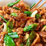 jaeyuk bokkeum served in a bowl with chopsticks